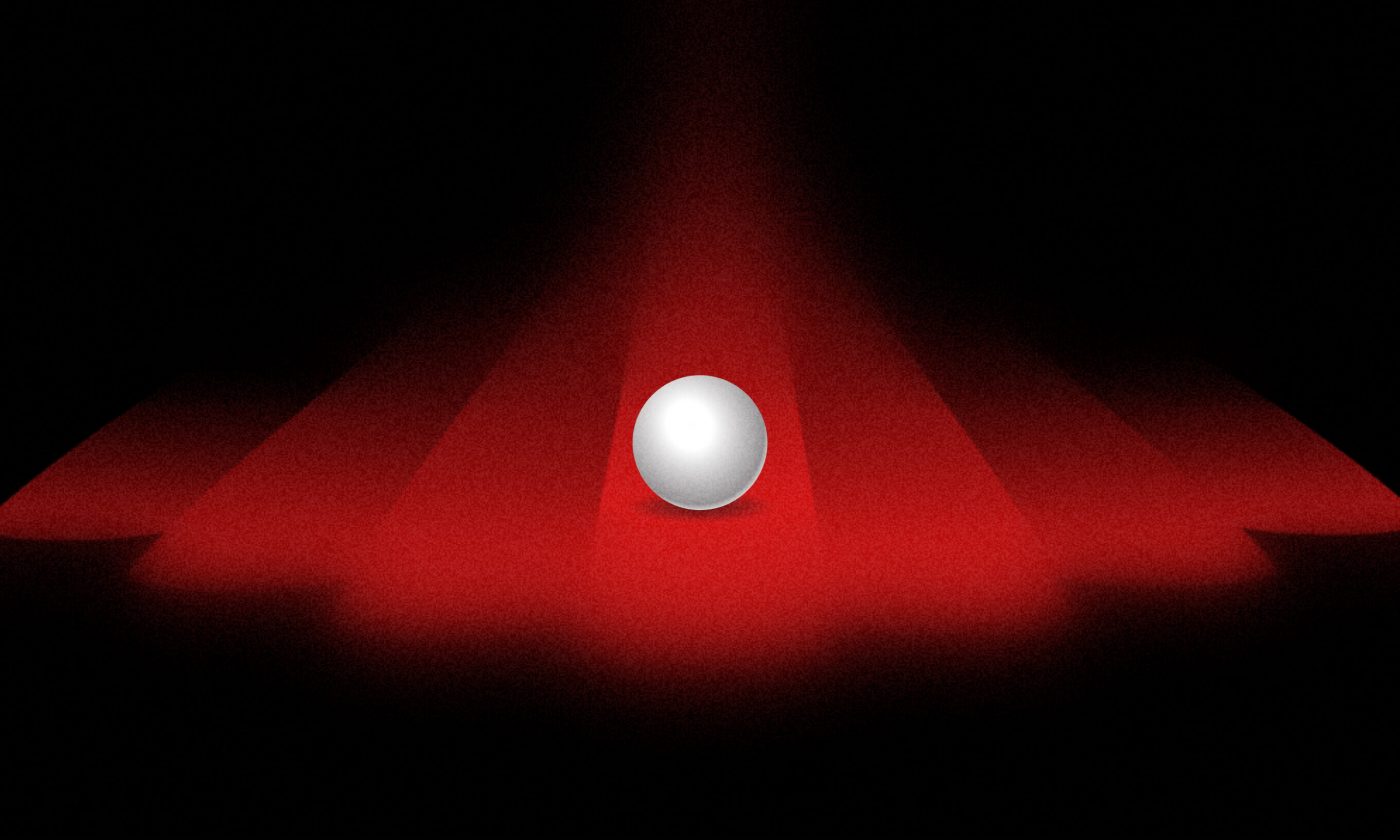 A white, pearl-like ball illuminated by red spotlights, symbolizing the clarity and focus Ruby on Rails development companies bring to web development projects.